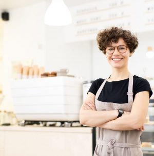 attractive-female-barista-in-coffee-shop-PCW6G7S.jpg