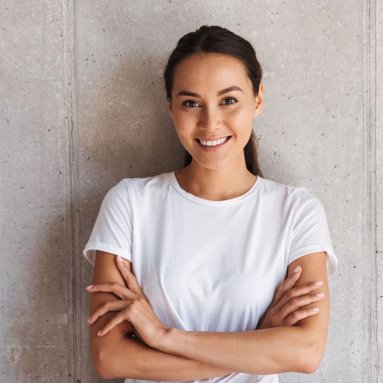 smiling-young-asian-woman-standing-with-arms-MXBNFDU.jpg